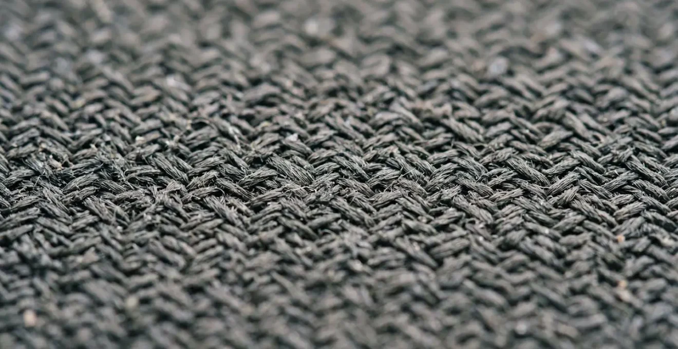 Texture macro d'un tapis de souris en tissu montrant le tissage et la structure des fibres